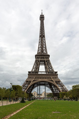 Fototapeta na wymiar Beautiful view of the Eiffel Tower in the city of Paris on cloudy day.