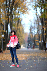 Girl in a yellow autumn park.