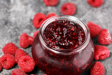 raspberry jam with fresh raspberries. marmalade in jar