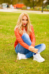 Fototapeta premium Young blonde woman in blue jeans