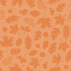 Fall leaves seamless vector background. Orange leaf silhouettes on light orange. Acorns, oak tree, maple tree pattern. Subtle autumn print. Fall background, Thanksgiving, Seasonal print, November