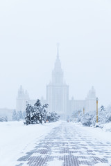 Fototapeta na wymiar Heavy snowfall in Moscow. houses and streets during blizzard