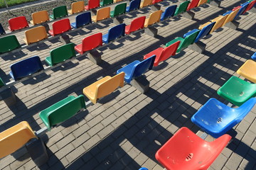  Colorful chairs on the stadium's platform