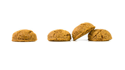 Pepernoten bunch of traditional cookies in a row on white background