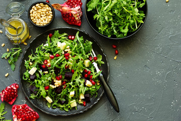 Fresh salad of arugula, beet and cheese.