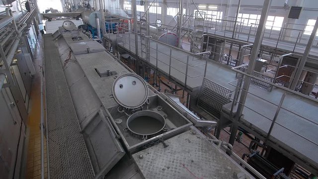 Dairy Plant. Milk Truck with a Tank Full of Milk at the Unloading