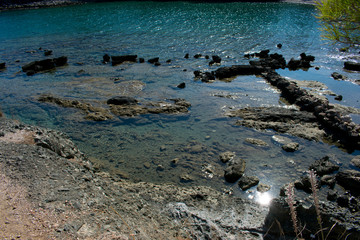 close up on sea or lake shallow water on coast of sea in phaselis beach in antalya, turkey 