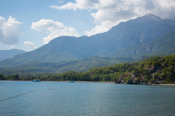 Beautiful landscape, mountains and sea against blue sky. Phaselis Beach in Antalia Turkey 