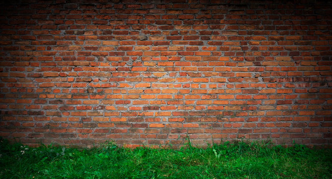 The texture of the brick is red. Background of empty brick basement wall.