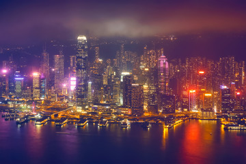 Aerial view of illuminated Hong Kong skyline. Hong Kong, China