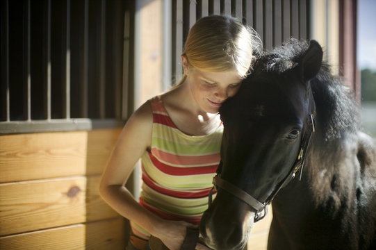 young girl with her horse