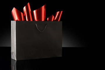 Shopping bag against a black background