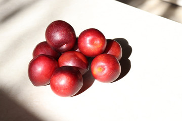 Plums on a modeled stone countertop