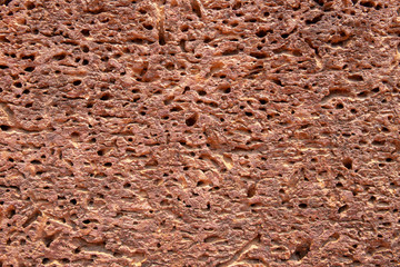Porous sandstone surface. Ancient rough texture of natural stone. Weathered stone closeup. Rustic grungy surface photo