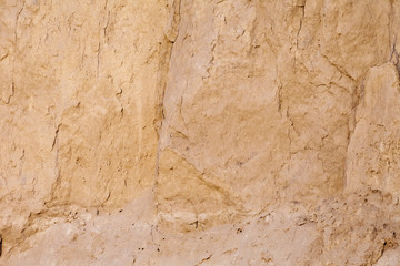 Wall background made clay mold clay into a residential home.