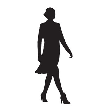 Businesswoman walking, side view, isolated vector silhouette. Business people