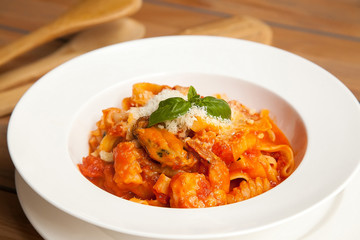 Pasta with seafood in tomato sauce