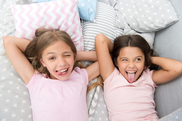 Slumber party timeless childhood tradition. Girls relaxing on bed. Slumber party concept. Girls...
