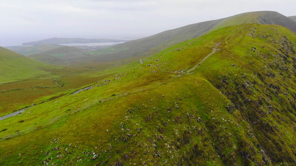 Fototapeta na wymiar The green hills of Ireland – aerial view from a drone