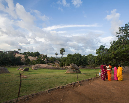 Women walking wearing saris