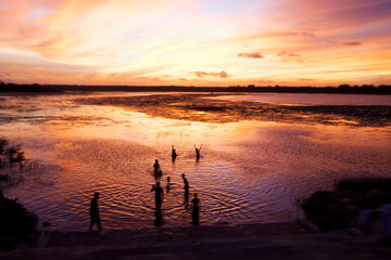 Shot in Sri Lanka.  This group of boys in the lake reminded me of a simpler way of life.  The dramatic sky provided the perfect backdrop for their silhouetted figures.