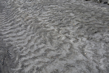 ripple marks of rivulet flowing through volcanic sand of the Tolbachik volcanic complex