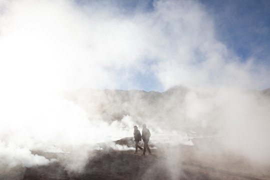 People walking on geyser field