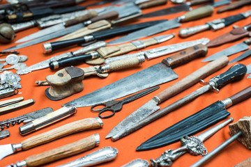 Fototapeta na wymiar Old knifes and scissors in San Telmo market, Buenos Aires, Argentina.