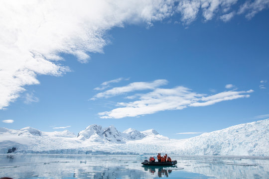 People on a boat on the waters of Antartica