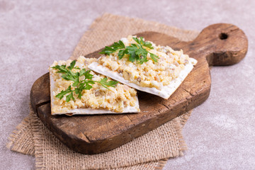 Matzo with kosher Forshmak on old wooden cutting board