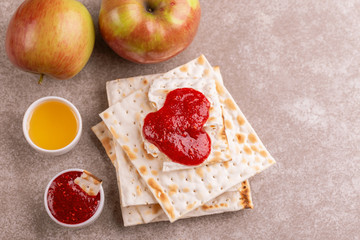 Traditional Jewish kosher matzo with apples, jam and honey