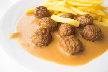 Famous swedish meatballs plate on gravy with french fries