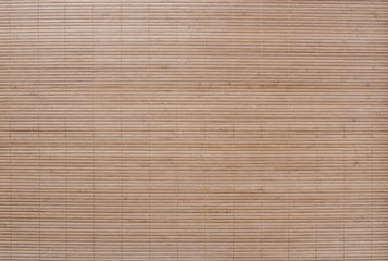 Textured background from bamboo table cloth. Very large seamless texture of wooden material.