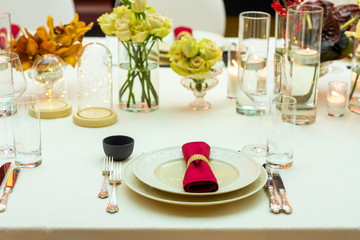 napkin in a ring on a plate in a restaurant on a served table