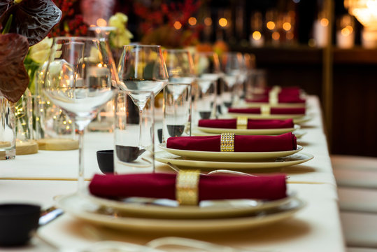 Restaurant table with napkins and wine glasses