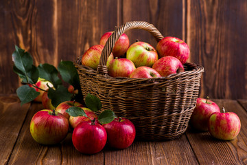 ripe red apples in a basket on the table