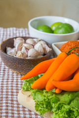 Fresh herbs and spices (chili, garlic, lettuce, lemon, cucumber)