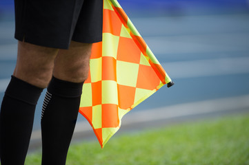 Assistant referee hold flag