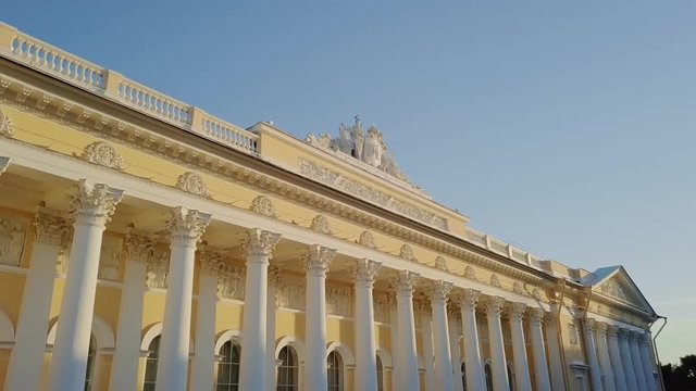 Russian Museum colomn view on a main building with sun setting down