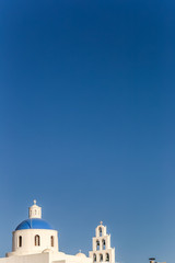 View to blue domes of Santorini island church, Greece