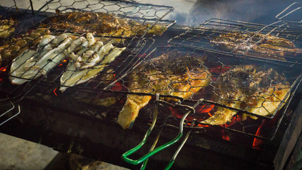 grilled fish on fish market traditional street food in indonesia