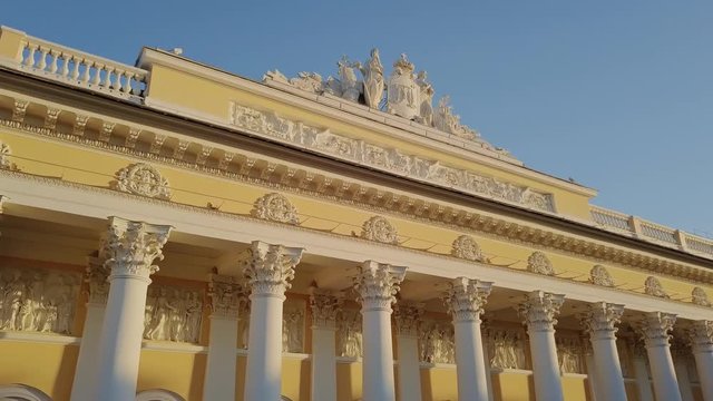 Russian Museum colomn view on a main building with sun setting down