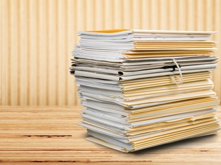 File folders with documents isolated on white