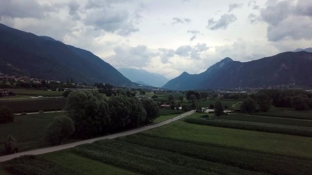 Aerial panoramic view of Levico Terme, Italy, during sunrise with views of the mountains.
