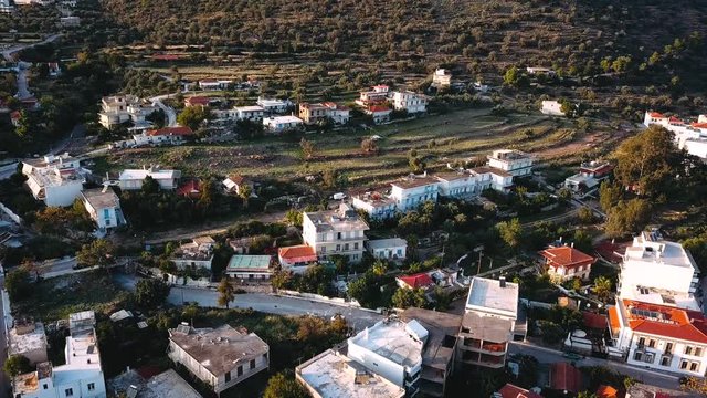 Flying over Methana houses and sailing yaht marina in Aegean sea, Greece.