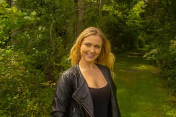 Fall woman in jacket in park