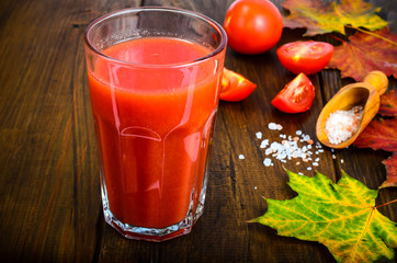Natural juice with pulp from fresh ripe red tomatoes