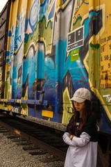 Fototapeta premium young woman in front of graffiti