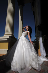 Obraz premium Elegant wedding salon is waiting for bride. Beautiful wedding dresses in boutique. Happy bride before wedding. Wonderful bridal gown. woman is preparing for wedding. Welcome to family. Happy moment
