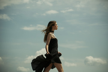 Joyful cute girl outdoor. Free and happy. Woman with fashion look. Future success. Girl on blue sky. Beauty and fashion style. Young and carefree. Loving her new style. Confident in her choice